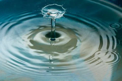 Water drop falling and colliding Stock Photos