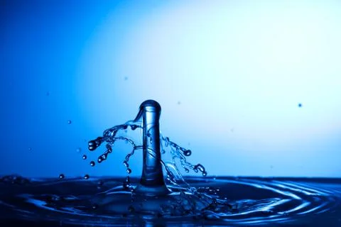 Water drop falling and colliding Stock Photos