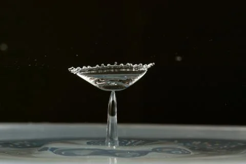 Water drop falling and colliding Stock Photos