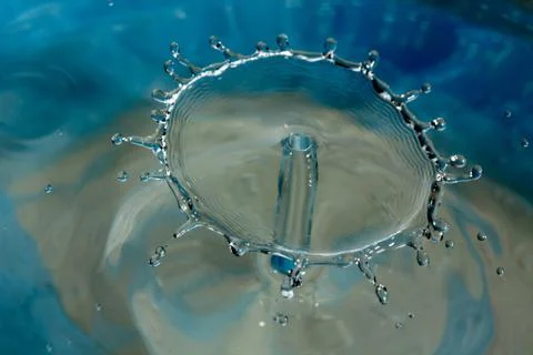 Water drop falling and colliding Stock Photos