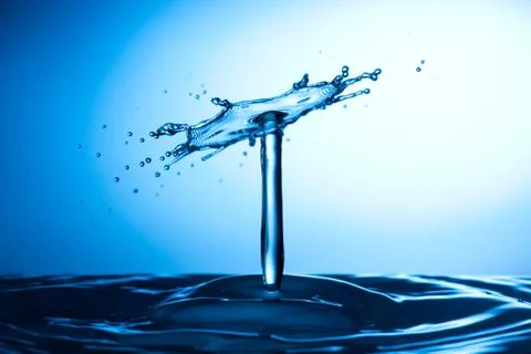 Water drop falling and colliding with another one Stock Photos