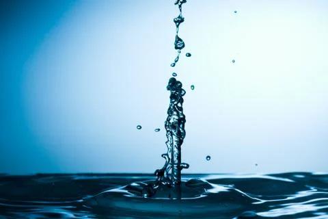 Water drop falling and colliding with another one Stock Photos