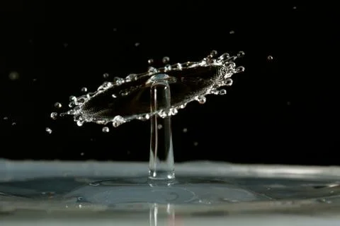 Water drop falling and colliding Stock Photos
