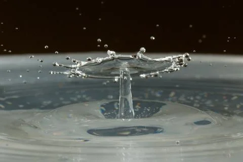 Water drop falling and colliding Stock Photos