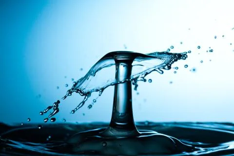 Water drop falling and colliding Stock Photos
