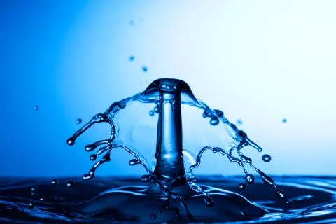 Water drop falling and colliding Stock Photos