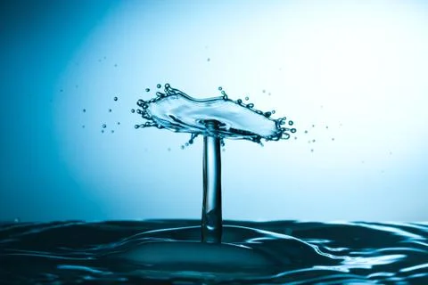Water drop falling and colliding Stock Photos