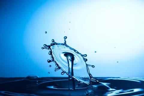 Water drop falling and colliding Stock Photos