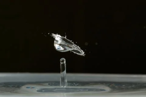 Water drop falling and colliding Stock Photos