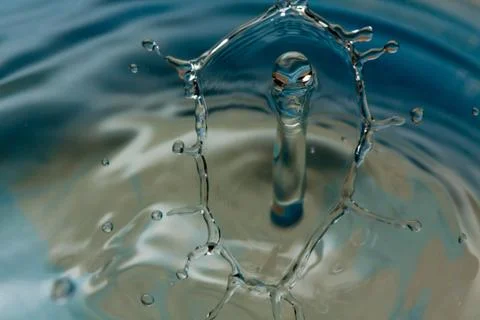 Water drop falling and colliding Stock Photos