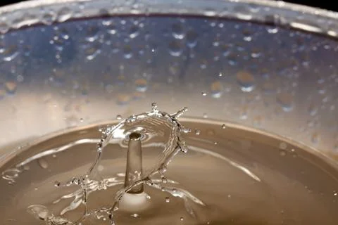 Water drop falling and colliding Stock Photos