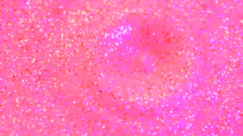 Water drop falling into beautiful pink rose neon glitter surface and splashing Stock Footage 141894328