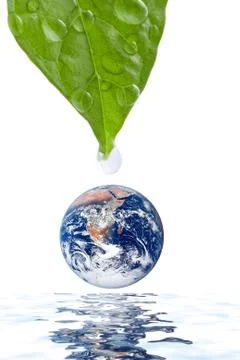 Water drop falling onto earth planet isolated Stock Photos