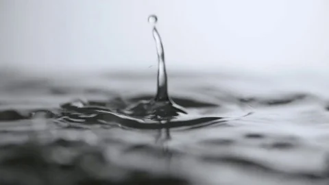 Water drop falling to liquid surface Full HD slow-motion video nature Clean rain Stock Footage 83143487