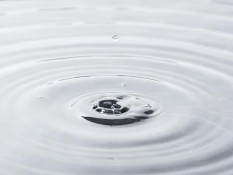 Water drop falling Stock Photos