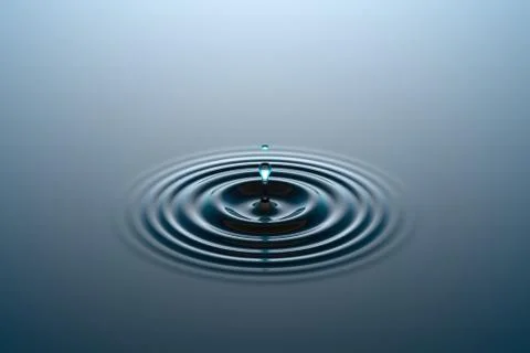Water drop falling into water surface Stock Illustration