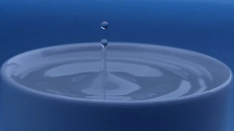 Water drop falls into the filled cup on blue background in slow motion. Stock Footage 142884927