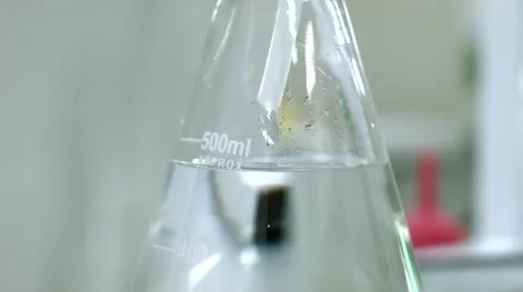 Water drop to flask in lab Video stock 52030814