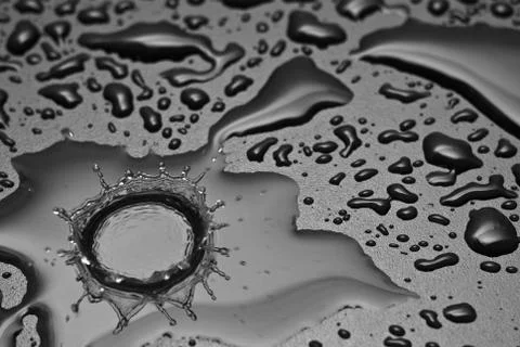 A water drop forms a crown Stock Photos