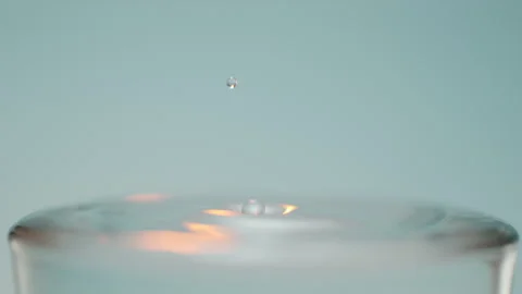 Water drop into glass close up 스톡 동영상 240134935