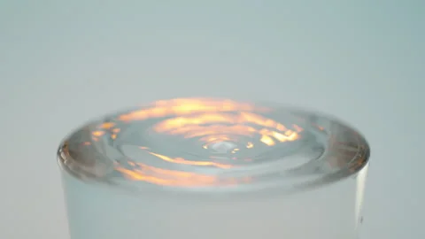 Water drop into glass 스톡 동영상 240134409