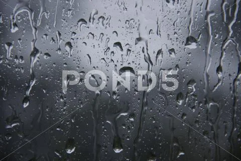 Water drop on glass Stock Photos