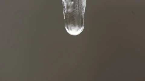 Water drop on the ice pipe in the nature Stock Footage