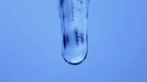 Water drop on the ice pipe in the nature Stock Footage