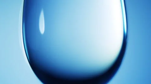 Water drop macro. The surface shimmers in different colors Stock Footage 45299448