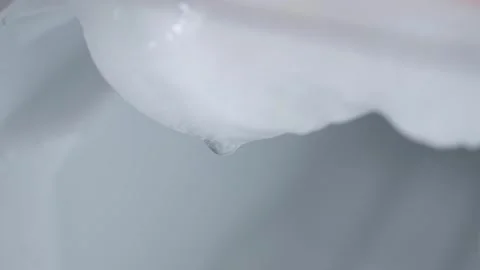 Water drop melting ice 스톡 동영상 345605070