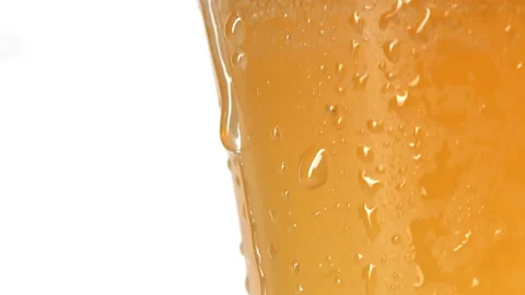 Water drop rolling down on cool fogged glass of light beer, freshness and Video stock 278655999