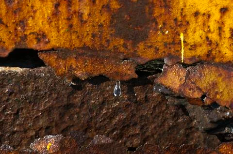 Water drop on a rusty wall Stock Photos
