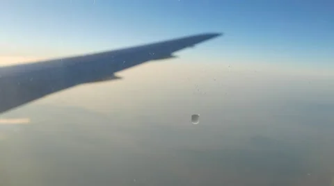 Water drop slowly flowing down on porthole Stock Footage 62594633