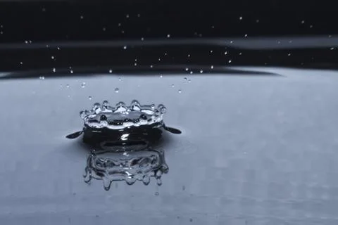Water drop splash in crown shape Stock Photos