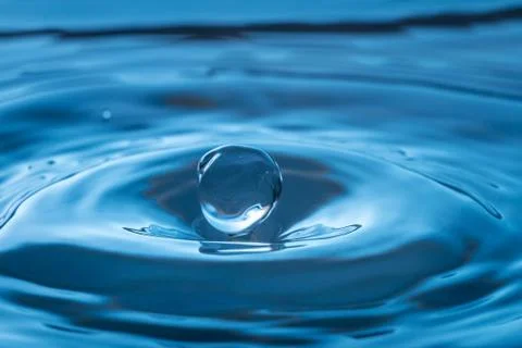 Water drop splash impact Stock Photos