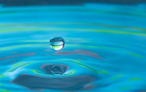 Water drop splash impact Stock Photos