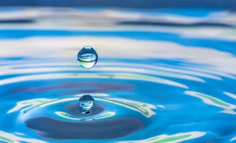 Water drop splash impact Stock Photos