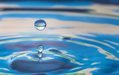 Water drop splash impact Stock Photos