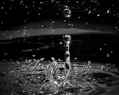 Water Drop Splashes To Create A Star Galaxy Stock Photos