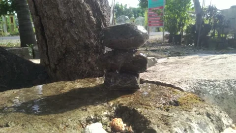 Water Drop on stack or balancing rock Stock Footage 163099112
