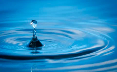 Water drop in sunlight Stock Photos