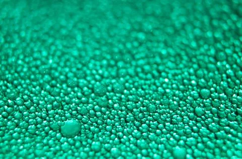 Water drop texture on turquoise background . Stock Photos