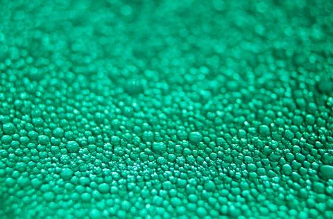 Water drop texture on turquoise background . Stock Photos