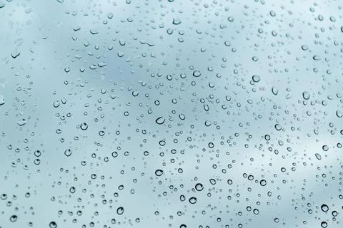 Water drop on white surface as background Stock Photos