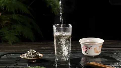 Water Droplet Falling Into White Tea Slow Motion Close Up Stock Footage 341668692