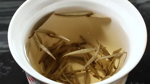 Water Droplet Falling Into White Tea Slow Motion Close Up Stock Footage 341668705