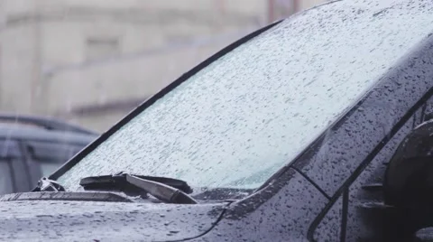 Water droplets on automobile windshield. Stock Footage 63112912