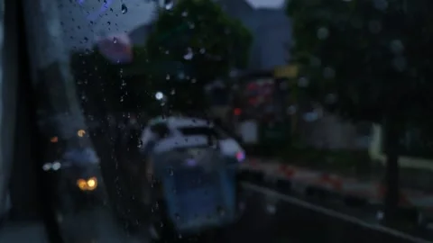 A water droplets on a bus window on a rainy day Stock Footage 276349057