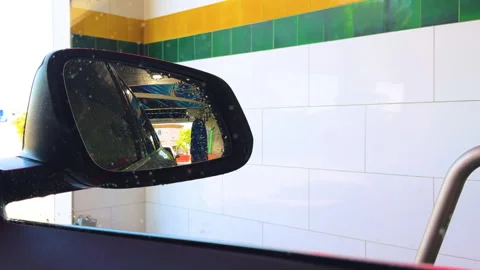 Water droplets on a car window during a car wash. Stock Footage 280065880