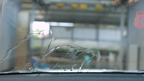 Water droplets on car windshield inside car wash facility, Water flowing Stock Footage 328235188
